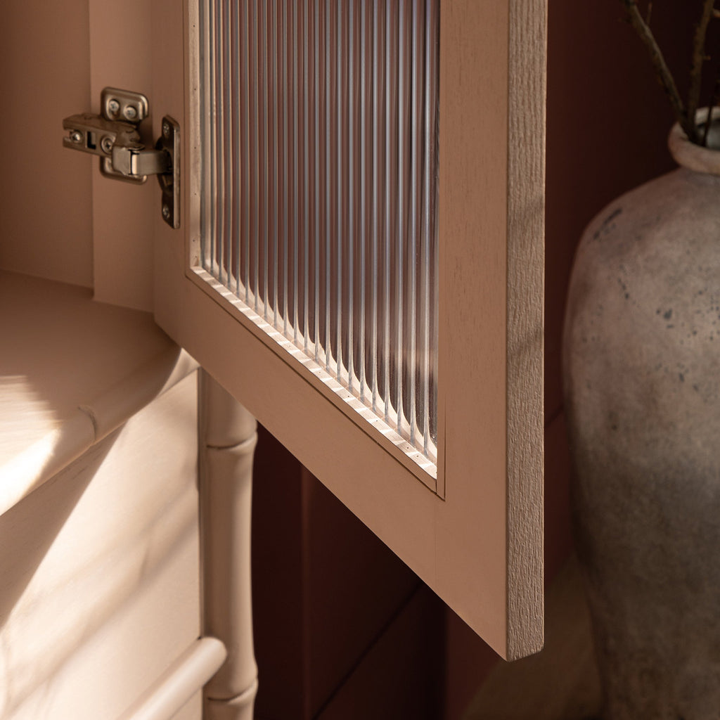 Elstowe Faux Bamboo and Fluted Glass 2-Door Cabinet, Nude Pink